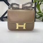 Constance 23.  Etoupe gold hardware And  Loewe puzzle tote.  Black. Red interior.