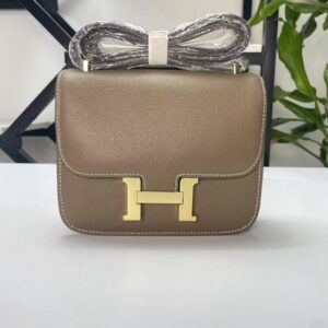 Constance 23.  Etoupe gold hardware And  Loewe puzzle tote.  Black. Red interior.