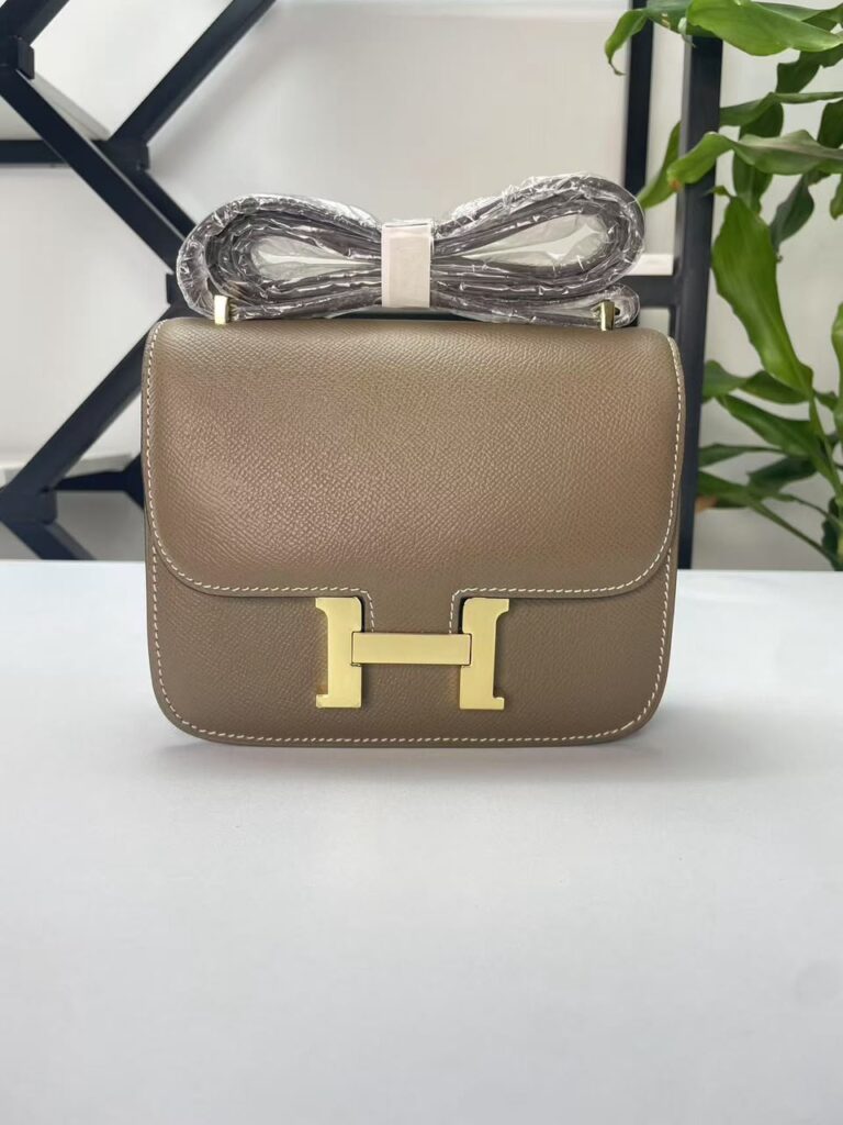 Constance 23.  Etoupe gold hardware And  Loewe puzzle tote.  Black. Red interior.